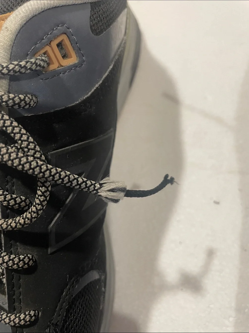 New Balance Men's Black and Gray Athletic Sneakers with Tan Accents